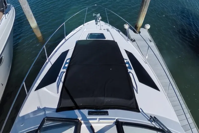 Slide: The Image of 2012 Regal 35 Sport Coupe docked, top view of bow and deck. - 42