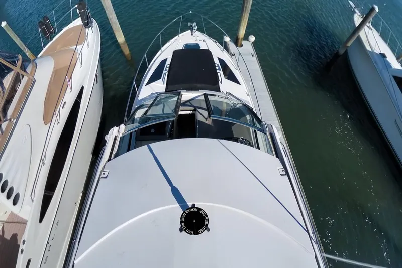 Slide: The Image of Overhead view of a 2012 Regal 35 Sport Coupe docked between boats. - 44