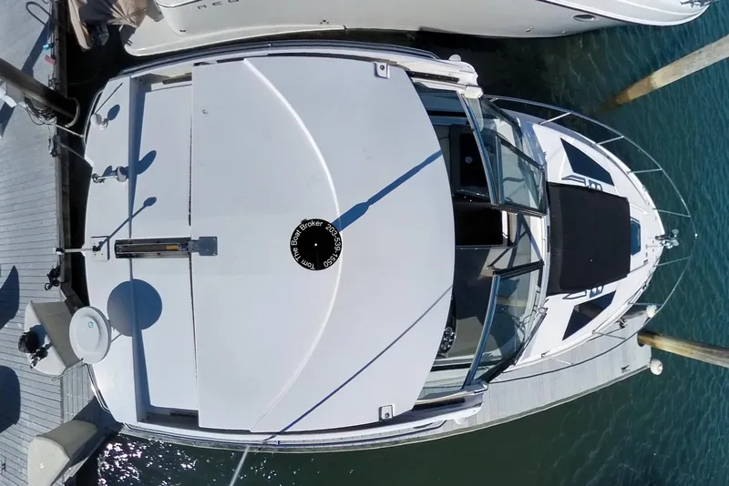Slide: The Image of Overhead view of a 2012 Regal 35 Sport Coupe docked at a marina. - 46