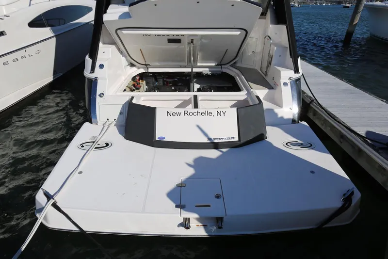 Slide: The Image of 2012 Regal 35 Sport Coupe docked in New Rochelle, NY, with open engine compartment. - 49