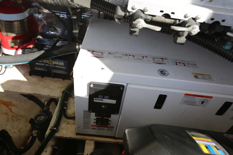 Slide: The Image of Engine room of 2012 Regal 35 Sport Coupe with Kohler generator and marine equipment. - 52