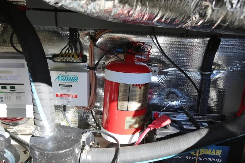 Slide: The Image of Engine compartment of 2012 Regal 35 Sport Coupe with fire extinguisher and wiring. - 55