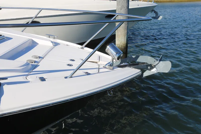 Slide: The Image of 2012 Regal 35 Sport Coupe boat docked on calm water. - 57