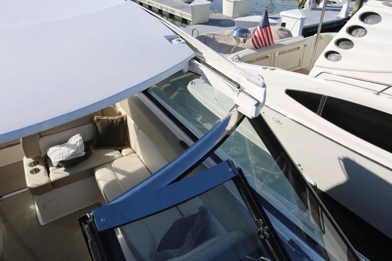 Slide: The Image of 2012 Regal 35 Sport Coupe yacht interior with seating and American flag. - 64