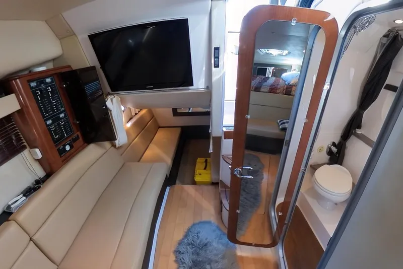 Slide: The Image of Interior of 2012 Regal 35 Sport Coupe with modern amenities and cozy seating. - 77