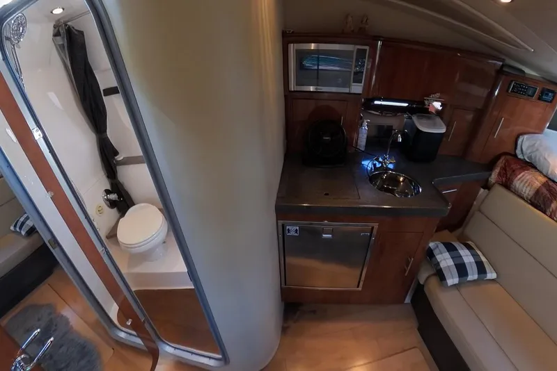 Slide: The Image of Interior of 2012 Regal 35 Sport Coupe with kitchenette and bathroom. - 78