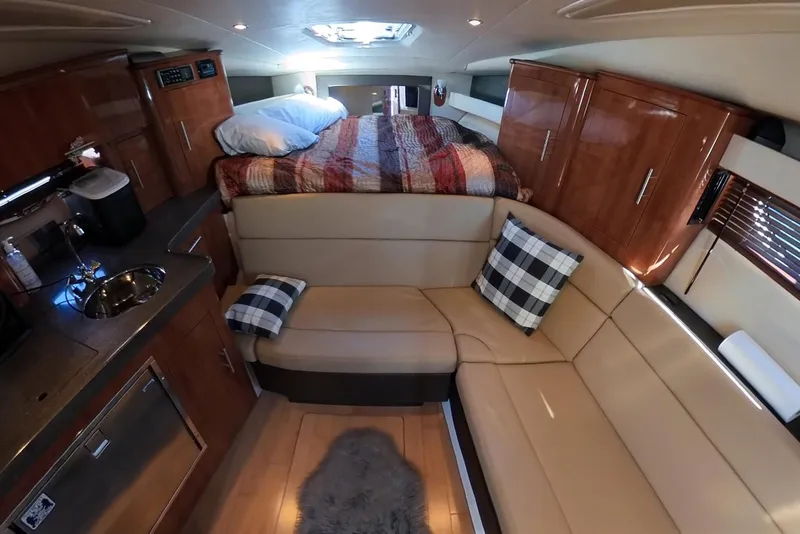 Slide: The Image of Interior of 2012 Regal 35 Sport Coupe with cozy seating and modern amenities. - 79