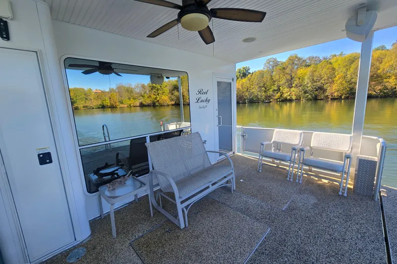 Slide: The Image of Houseboat deck with seating, ceiling fan, and scenic river view; Thoroughbred 80'x 18', 2013 model. - 18