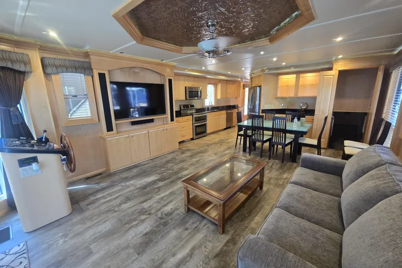 Slide: The Image of Luxurious 2013 Thoroughbred houseboat interior with modern kitchen, dining area, and cozy living space. - 21