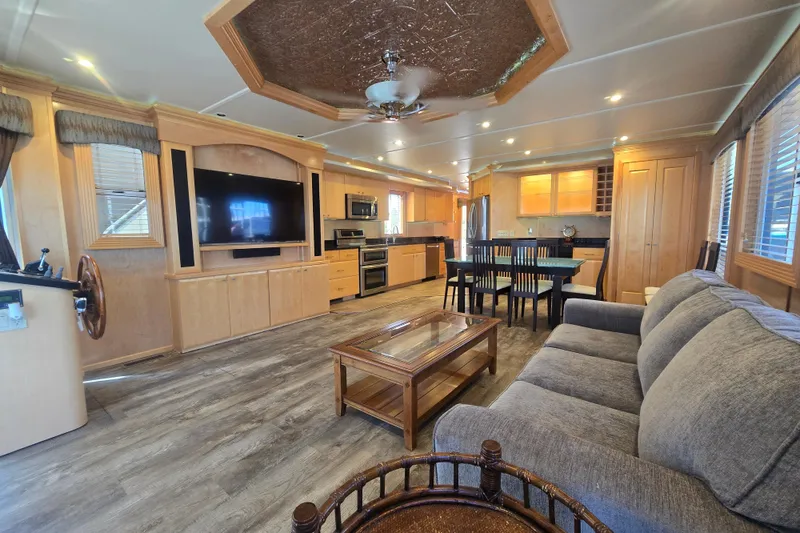 Slide: The Image of Luxurious 2013 Thoroughbred houseboat interior with modern kitchen, spacious living area, and elegant decor. - 22