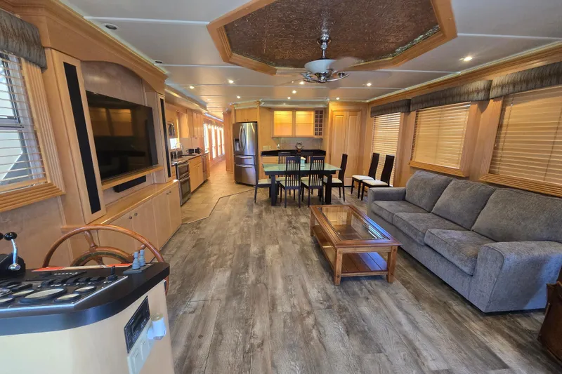 Slide: The Image of Luxurious 2013 Thoroughbred houseboat interior with modern kitchen, dining area, and cozy living space. - 23