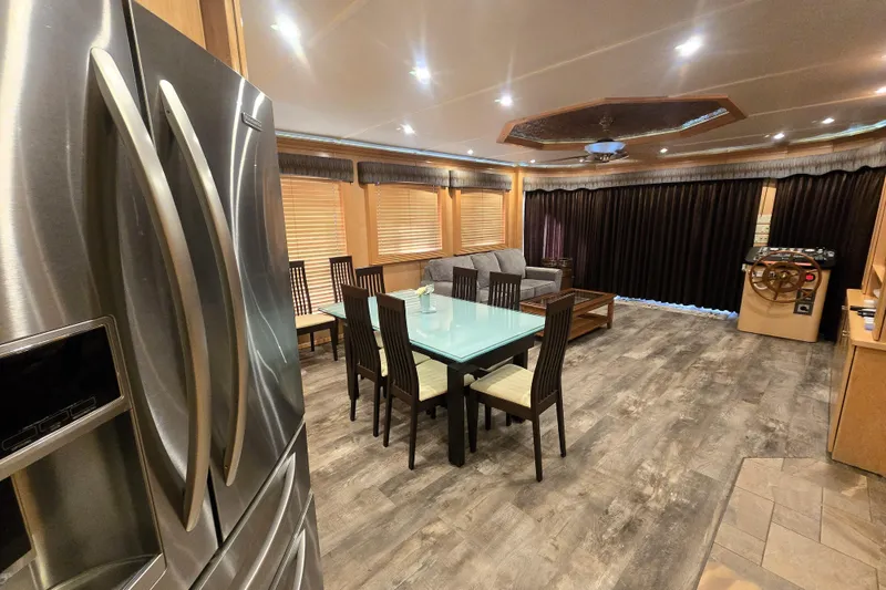 Slide: The Image of Luxurious Thoroughbred 80'x 18' interior, featuring modern kitchen and dining area, 2013 model. - 26
