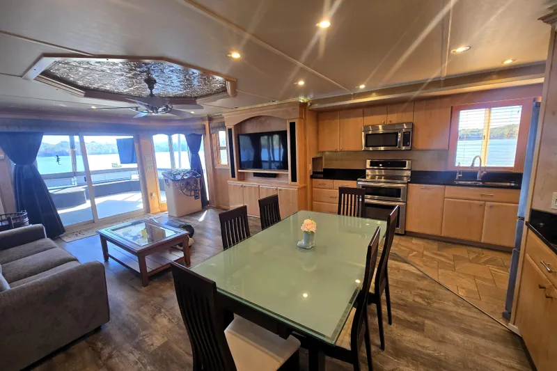 Slide: The Image of Luxurious 2013 Thoroughbred houseboat interior with modern kitchen, dining area, and lake view. - 30