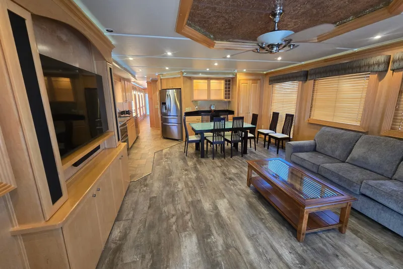 Slide: The Image of Luxurious 2013 Thoroughbred houseboat interior with modern kitchen, dining area, and cozy living space. - 31