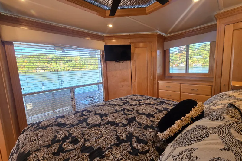 Slide: The Image of Luxurious bedroom in 2013 Thoroughbred houseboat with lake view and elegant decor. - 36