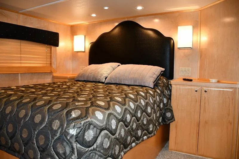 Slide: The Image of Luxurious bedroom interior in 2013 Thoroughbred 80'x 18' model with elegant bedding. - 40
