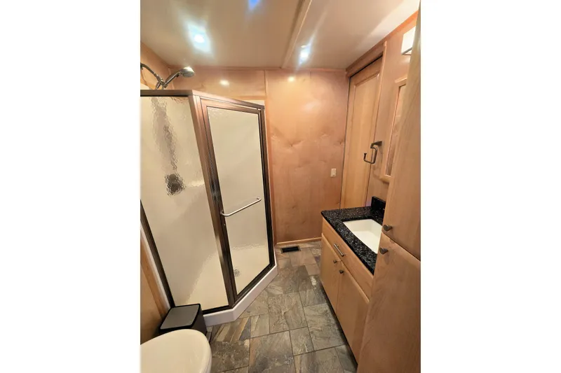 Slide: The Image of Modern bathroom in 2013 Thoroughbred 80'x 18' model with shower and vanity. - 43