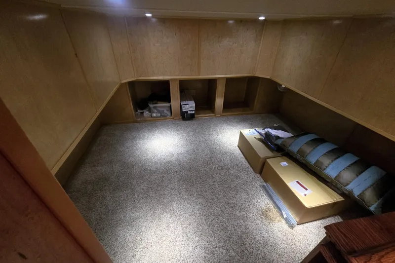 Slide: The Image of Spacious interior of 2013 Thoroughbred model, featuring carpeted flooring and wooden paneling. - 49