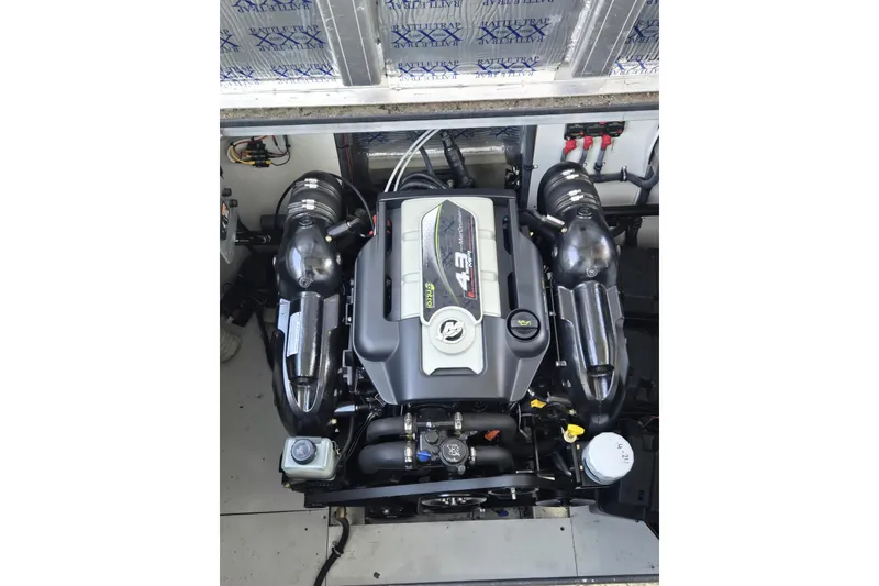 Slide: The Image of Engine compartment of a 2013 Thoroughbred 80'x 18' boat, featuring a MerCruiser 4.3L engine. - 51