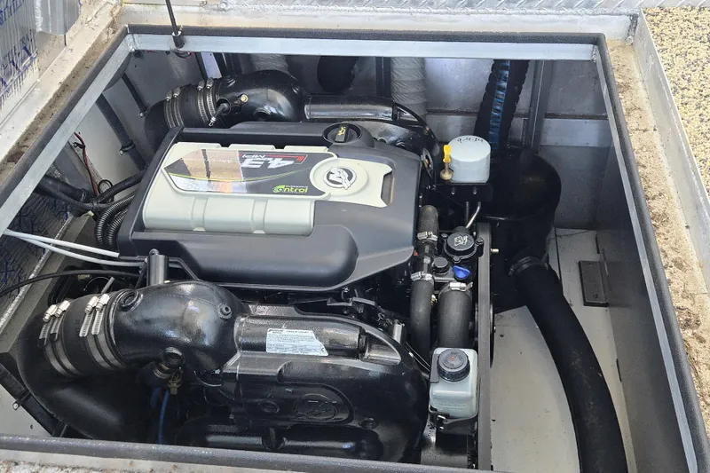 Slide: The Image of Engine compartment of a 2013 Thoroughbred 80'x 18' model, showcasing detailed components. - 52