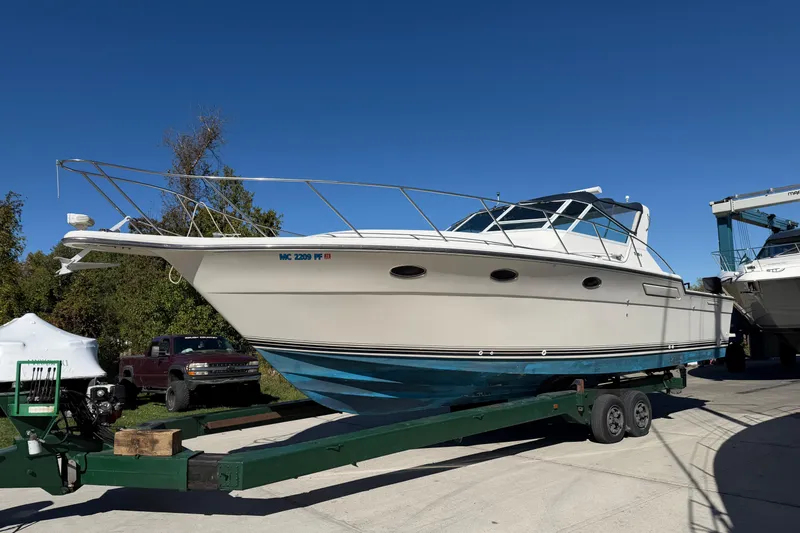 Slide: The Image of 1988 Tiara Yachts 3600 Open on trailer, displayed outdoors under clear blue sky. - 2