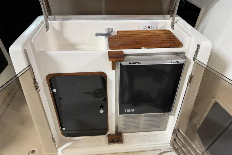 Slide: The Image of 1988 Tiara Yachts 3600 Open cockpit with sink, Raritan ice maker, and storage. - 24