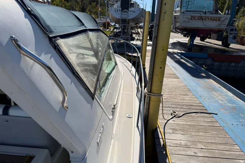 Slide: The Image of 1988 Tiara Yachts 3600 Open docked, showcasing sleek design and sturdy build. - 31