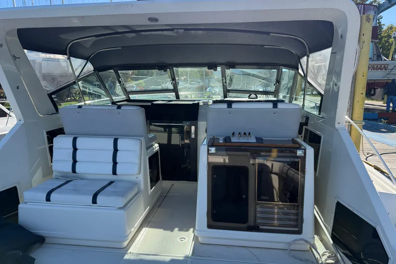 Slide: The Image of 1988 Tiara Yachts 3600 Open cockpit with seating and control panel. - 34