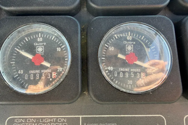 Slide: The Image of Analog engine hour meters on a 1988 Tiara Yachts 3600 Open dashboard. - 38