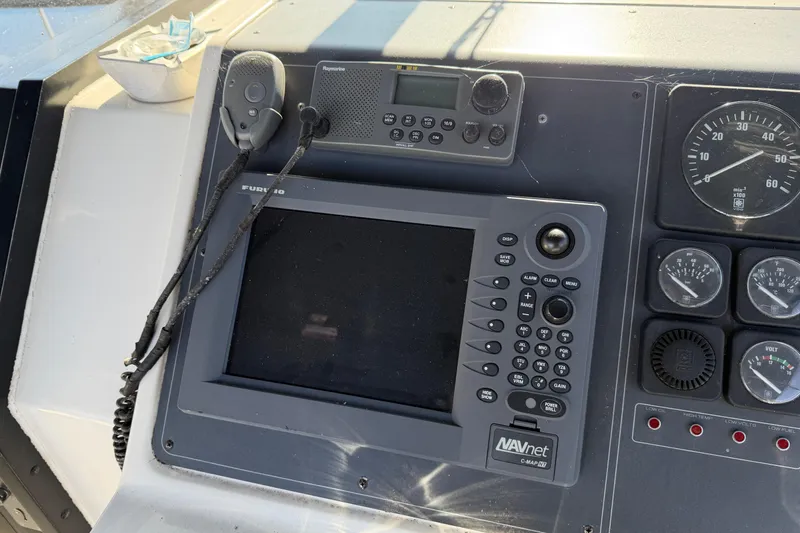 Slide: The Image of Control panel of a 1988 Tiara Yachts 3600 Open with navigation equipment. - 39