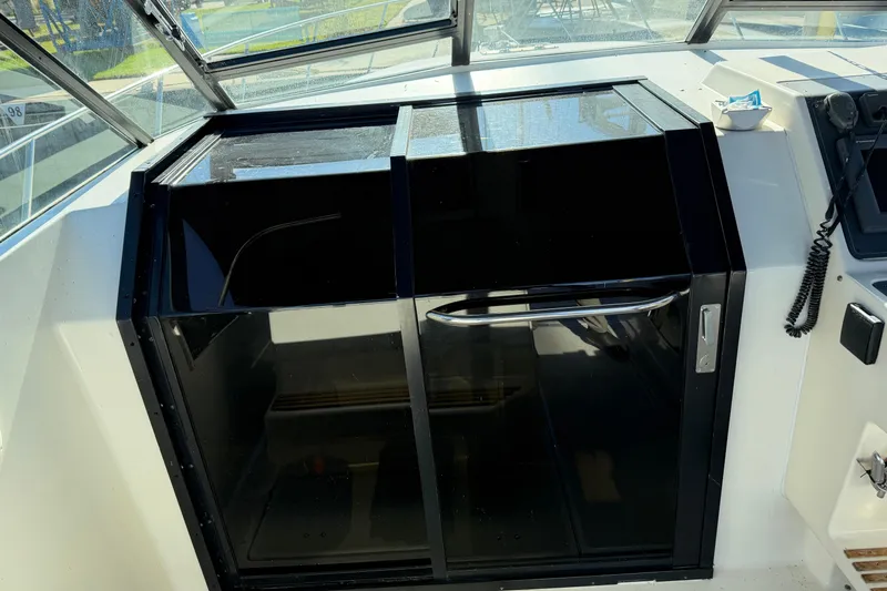 Slide: The Image of 1988 Tiara Yachts 3600 Open cabin entrance with black sliding doors. - 45