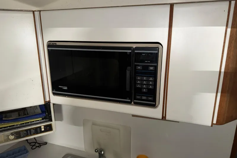 Slide: The Image of Microwave in 1988 Tiara Yachts 3600 Open kitchen area, featuring classic design. - 48