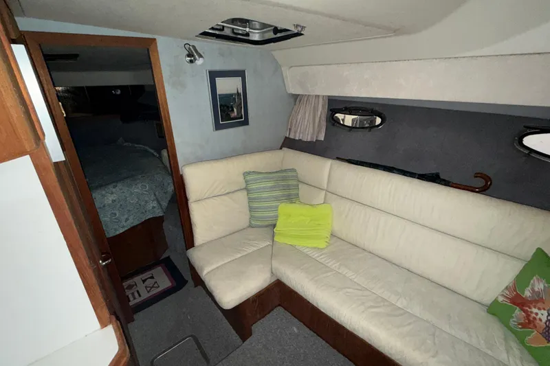 Slide: The Image of Interior of 1988 Tiara Yachts 3600 Open with cozy seating and decor. - 53