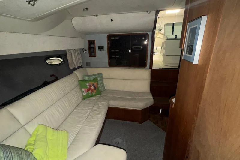 Slide: The Image of Interior of 1988 Tiara Yachts 3600 Open with cozy seating and nautical decor. - 54