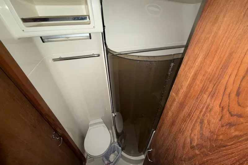 Slide: The Image of 1988 Tiara Yachts 3600 Open bathroom with shower and toilet. - 57