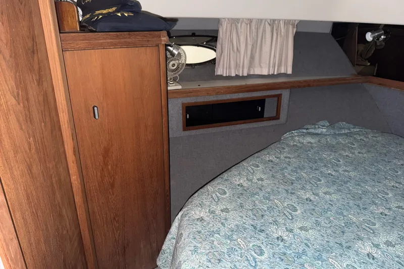 Slide: The Image of 1988 Tiara Yachts 3600 Open cabin interior with wood paneling and bed. - 61
