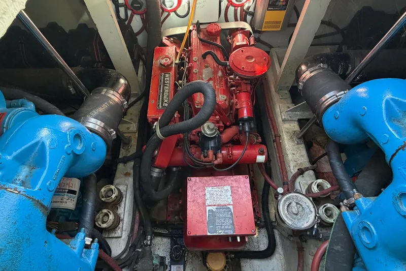 Slide: The Image of Engine room of 1988 Tiara Yachts 3600 Open with visible machinery and components. - 67