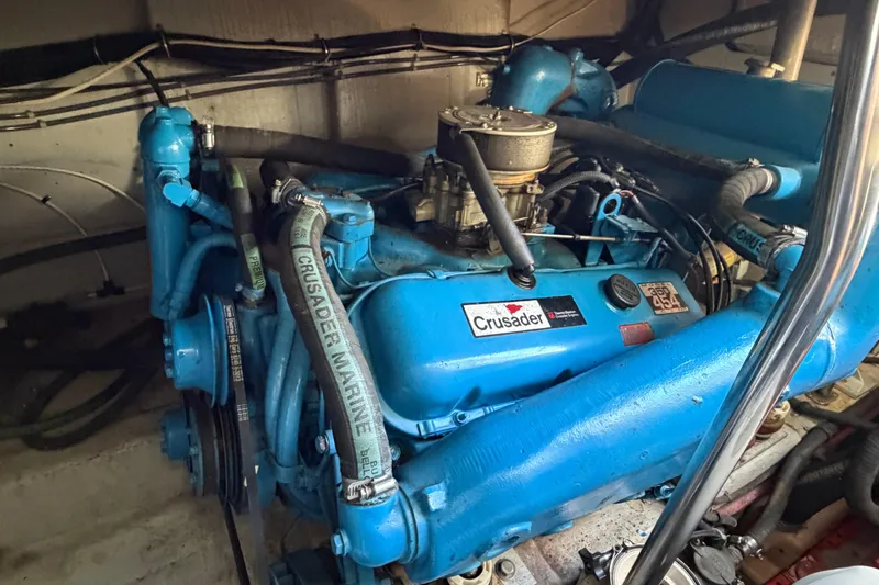 Slide: The Image of 1988 Tiara Yachts 3600 Open engine, featuring a blue Crusader Marine motor. - 68