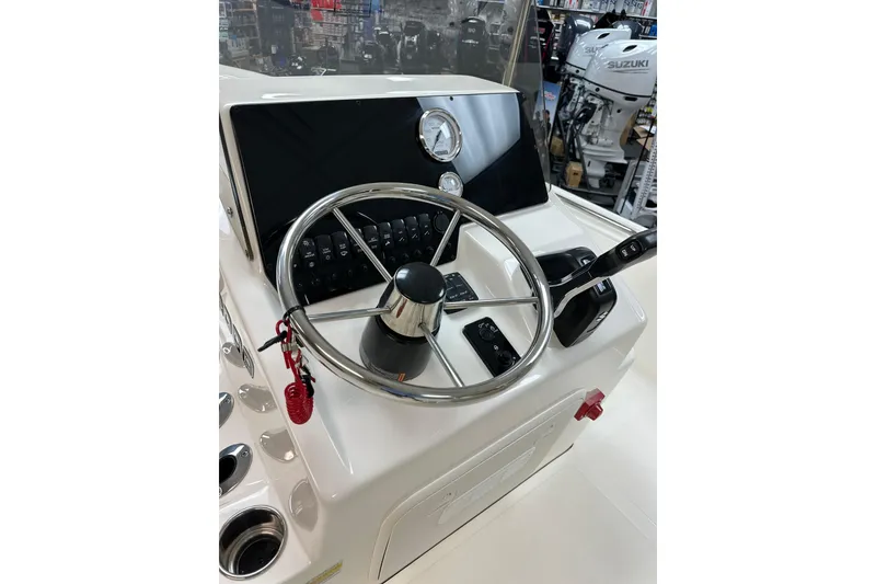 Slide: The Image of Steering console of 2025 Bulls Bay 2000 boat with modern controls and gauges. - 12