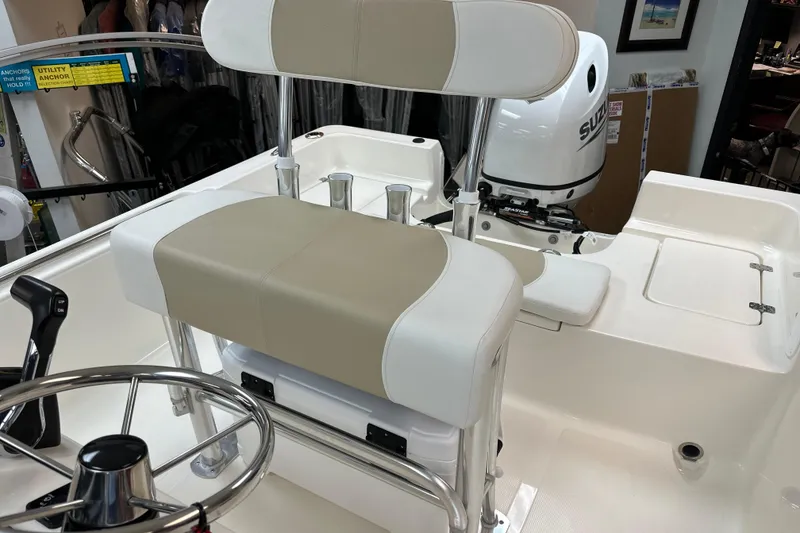 Slide: The Image of 2025 Bulls Bay 2000 boat interior with steering wheel and seating. - 13