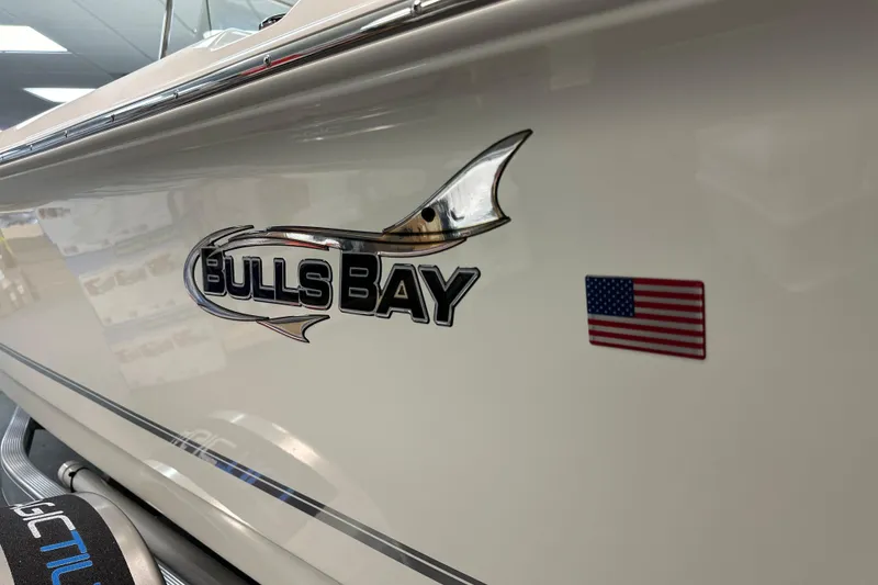 Slide: The Image of 2025 Bulls Bay 2000 boat logo with American flag decal. - 17