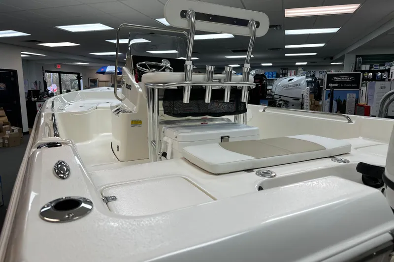 Slide: The Image of 2025 Bulls Bay 2000 boat interior with seating and rod holders in showroom. - 18