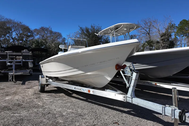 Slide: The Image of 2025 Bulls Bay 2000 boat on trailer, parked outdoors under clear blue sky. - 3