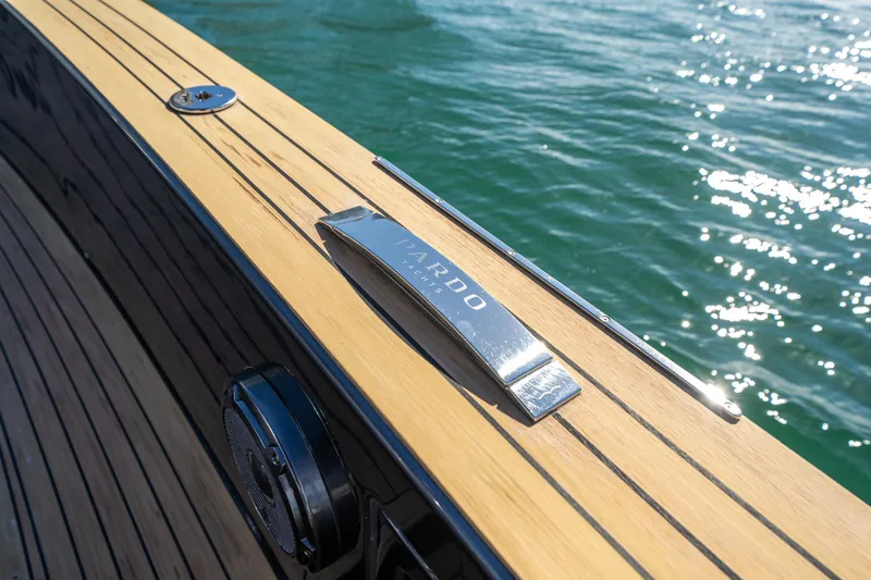 Slide: The Image of Pardo Yachts 43 (2023) deck detail with sleek wood finish and chrome accents. - 11