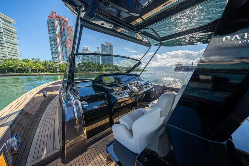 Slide: The Image of 2023 Pardo Yachts 43 interior with modern helm, cityscape, and ocean view. - 18