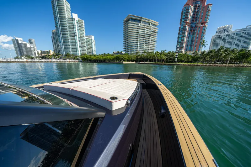 Slide: The Image of 2023 Pardo Yachts 43 cruising near modern city skyline and waterfront. - 20