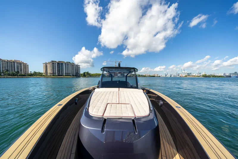 Slide: The Image of 2023 Pardo Yachts 43 on water, city skyline in background, sunny day. - 22