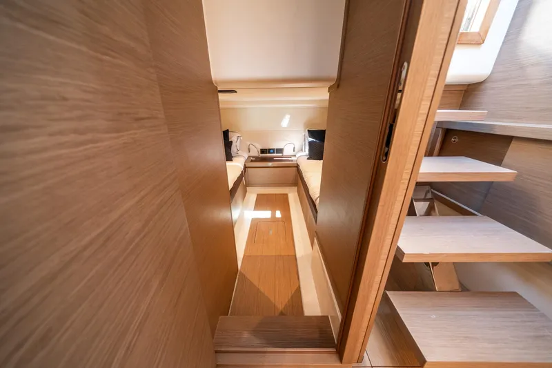 Slide: The Image of Interior of 2023 Pardo Yachts 43, featuring wooden finishes and modern design elements. - 27