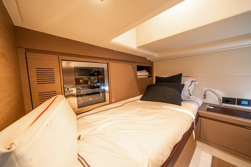 Slide: The Image of Luxurious cabin interior of 2023 Pardo Yachts 43 with cozy bed and wine cooler. - 29