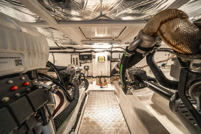 Slide: The Image of Engine room of 2023 Pardo Yachts 43, showcasing mechanical components and wiring. - 40